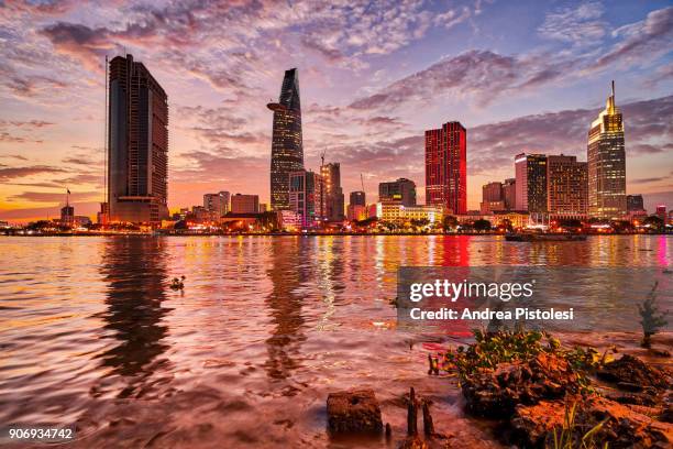 ho chi minh city skyline in saigon river, vietnam - ho chi minh city stock-fotos und bilder