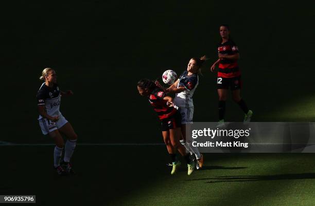 Lia Privitelli of the Victory competes for the ball against Lo'eau LaBonta of the Wanderers during the round 12 W-League match between the Western...