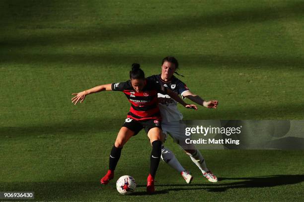 Alix Roberts of the Wanderers is challenged by Melina Ayres of the Victory during the round 12 W-League match between the Western Sydney Wanderers...