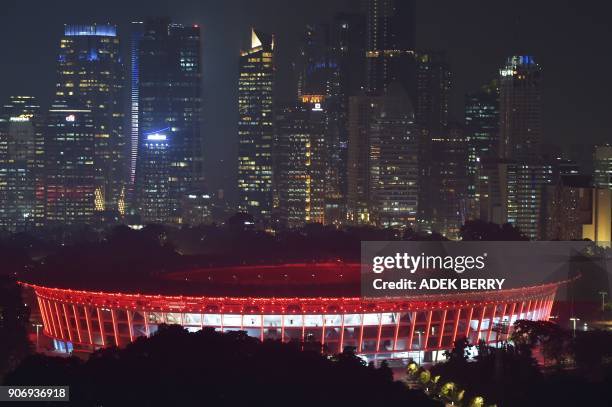 This photo taken on January 18, 2018 shows the fully-renovated Gelora Bung Karno Stadium lit up at night in Jakarta, which will be used for the...