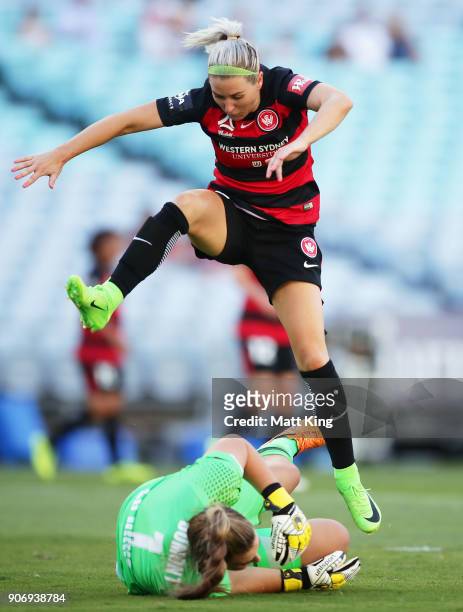 Erica Halloway of the Wanderers avoids Victory goalkeeper Casey Dumont during the round 12 W-League match between the Western Sydney Wanderers and...