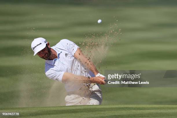 Dustin Johnson of the United States plays his third shot from a bunker on the second hole during round two of the Abu Dhabi HSBC Golf Championship at...