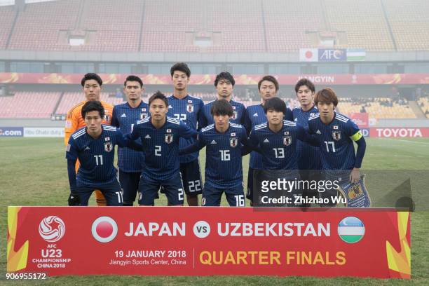 Players of Japan line up for team photos prior to AFC U23 Championship Quarter-final between Japan and Uzbekistan at Jiangyin Sports Center on...
