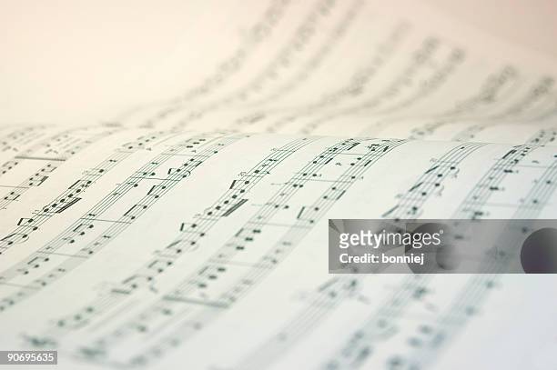 a music book open with music notes in black and white - sheet music stock pictures, royalty-free photos & images