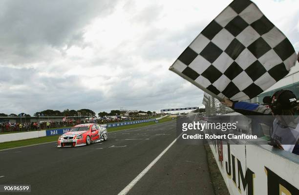 Garth Tander driving the Holden Racing Team Holden crosses the line to win race 17 for round nine of the V8 Supercar Championship Series at the...