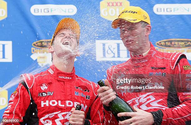 Will Davison and Garth Tander of the Holden Racing Team celebrate after winning race 17 for round nine of the V8 Supercar Championship Series at the...
