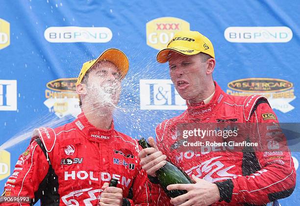 Will Davison and Garth Tander of the Holden Racing Team celebrate after winning race 17 for round nine of the V8 Supercar Championship Series at the...