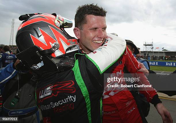 Garth Tander of the Holden Racing Team celebrates with his wife Leanne Tander after winning race 17 for round nine of the V8 Supercar Championship...