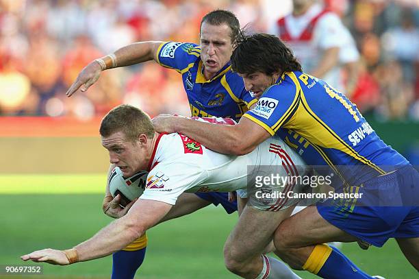 Ben Creagh of the Dragons is tackled during the fourth NRL qualifying final match between the St George Illawarra Dragons and the Parramatta Eels at...