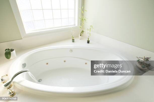 bath time - running water bath stock pictures, royalty-free photos & images