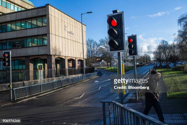 Red traffic lights shine at a pedestrian crossing near the Carillion Plc headquarter offices in Wolverhampton, U.K., on Thursday, Jan. 18, 2018. The...