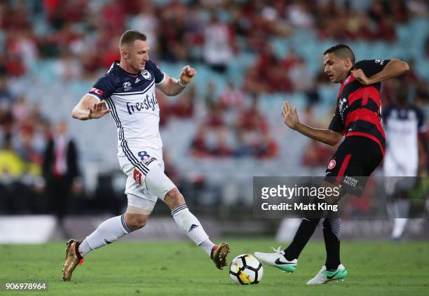 Besart Berisha of the Victory is challenged by Marcelo Carrusca of the Wanderers during the round 17 A-League match between the Western Sydney...