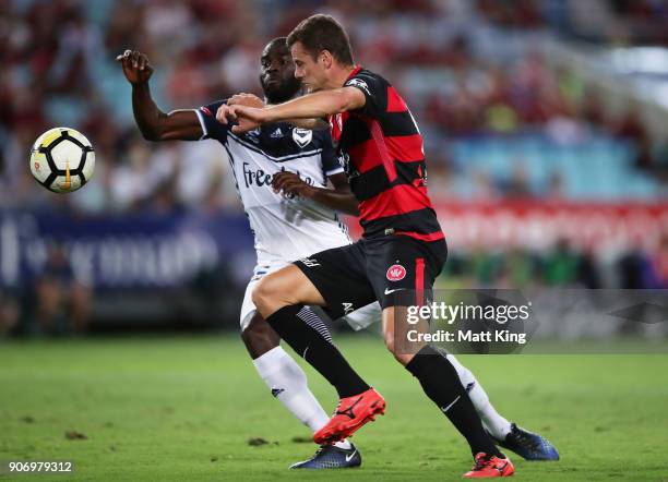 Oriol Riera of the Wanderers is challenged by Jason Geria of the Victory during the round 17 A-League match between the Western Sydney Wanderers and...