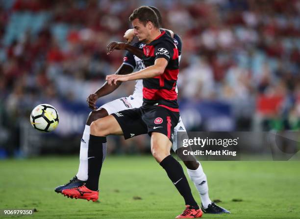 Oriol Riera of the Wanderers is challenged by Jason Geria of the Victory during the round 17 A-League match between the Western Sydney Wanderers and...