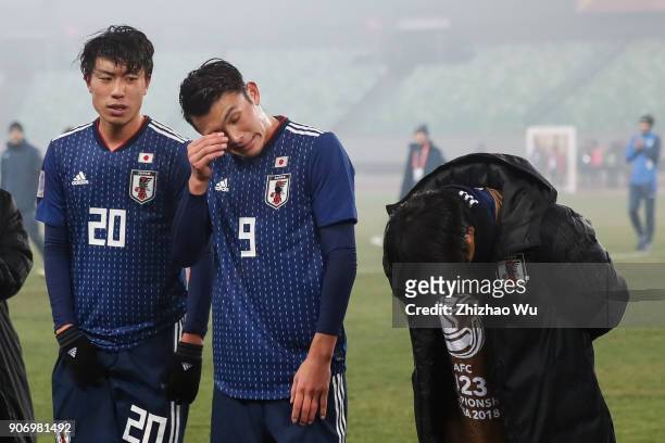 Tagawa Kyosuke and Koga Taiyo of Japan show their dejection after AFC U23 Championship Quarter-final between Japan and Uzbekistan at Jiangyin Sports...