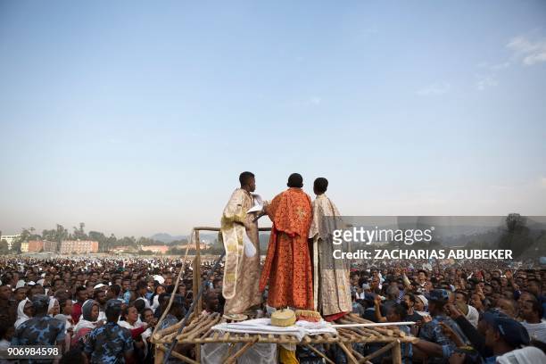 Clergyboys spray blessed water onto patrons of the Ethiopian Orthodox church during the Timket, an Epiphany festival, in Addis Ababa, on January 19,...