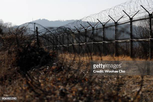 Layers of barbed wire stand at the border of Civilian Controled Zone in Yulgok Park on January 19, 2018 in Paju, South Korea. The bicycle torch relay...