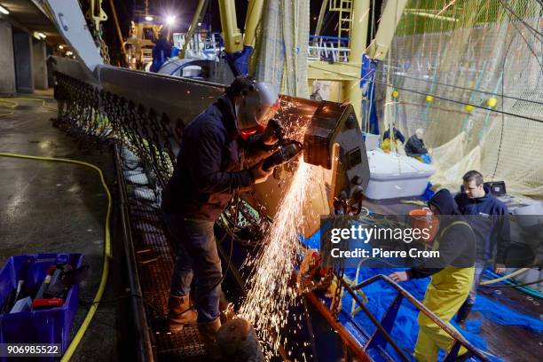 Worker repairs pulse fishing nets in the port of Scheveningen on January 19, 2018 in The Hague, Netherlands. A large majority of members of the...