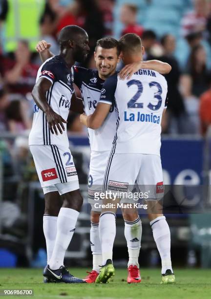 Kosta Barbarouses of the Victory celebrates with team mates after scoring his second goal during the round 17 A-League match between the Western...