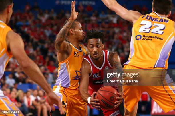 Jean-Pierre Tokoto of the Wildcats works thru traffic to the basket during the round 15 NBL match between the Perth Wildcats and the Sydney Kings at...