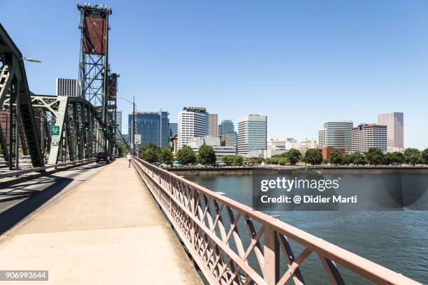 portland downtown district view from the hawthorne bridge - portland - oregon stock pictures, royalty-free photos & images