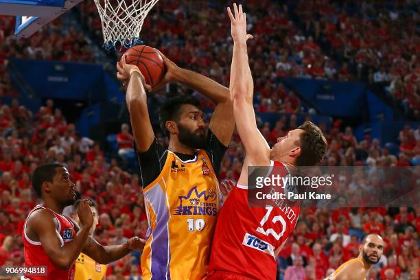Amritpal Singh of the Kings rebounds against Angus Brandt of the Wildcats during the round 15 NBL match between the Perth Wildcats and the Sydney...