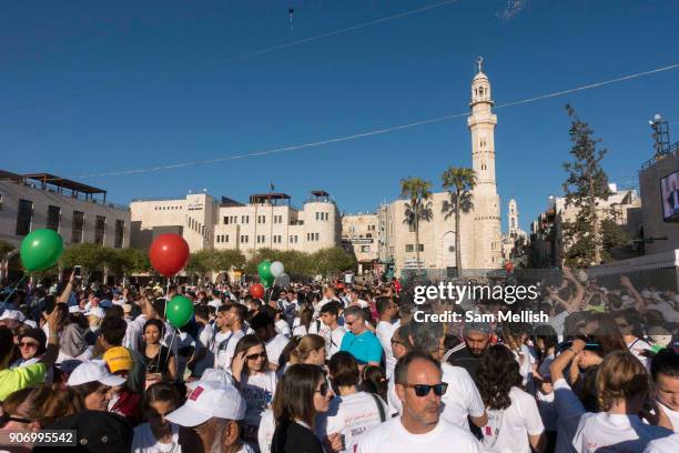 Busy Manger Square with runners ready for the Palestine Marathon on 1st April 2016 in Bethlehem, West Bank. During the Palestine Marathon, thousands...