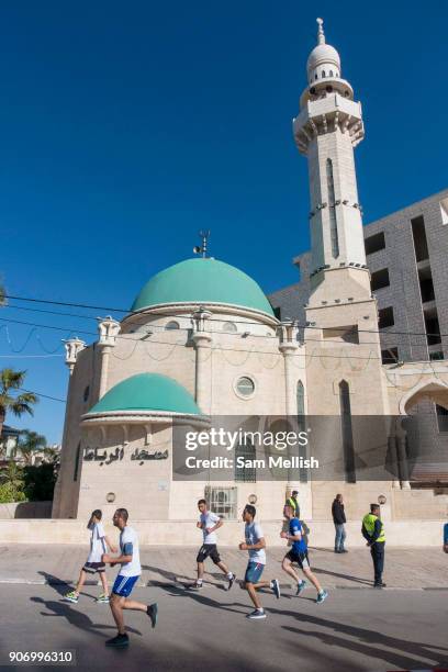 Participants running during the Palestine Marathon on 1st April 2016 in Bethlehem, West Bank. During the Palestine Marathon, thousands of runners,...