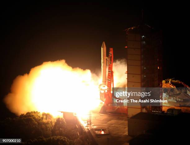 In this aerial image, the Japan Aerospace Exploration Agency 's Epsilon-3 small solid-fuel rocket carrying radar-imaging satellite ASNARO-2 lifts off...