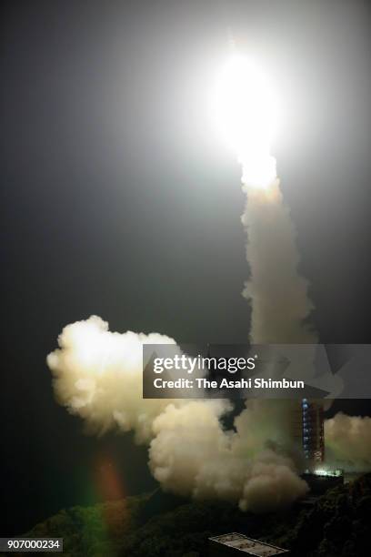 In this aerial image, the Japan Aerospace Exploration Agency 's Epsilon-3 small solid-fuel rocket carrying radar-imaging satellite ASNARO-2 lifts off...