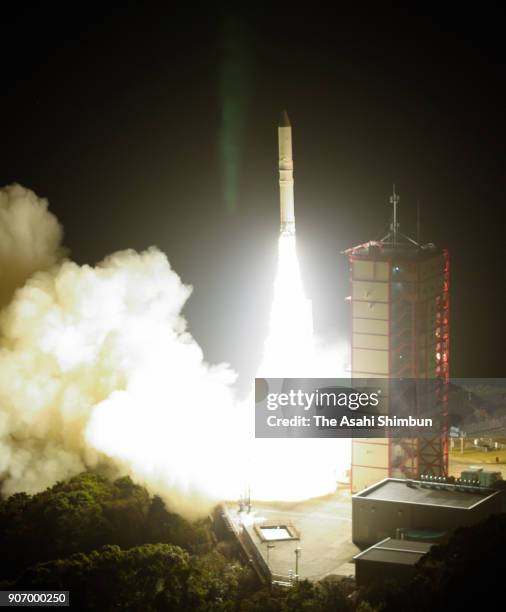 In this aerial image, the Japan Aerospace Exploration Agency 's Epsilon-3 small solid-fuel rocket carrying radar-imaging satellite ASNARO-2 lifts off...