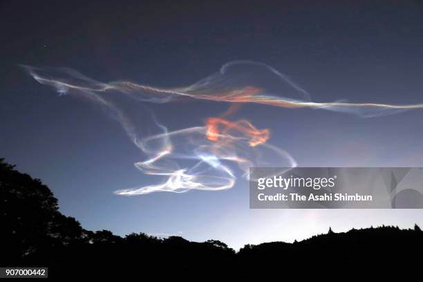 Gas plume from the Epsilon-3 rocket drifts in the sky before sunrise after its launch from the JAXA Uchinoura Space Center on January 18, 2018 in...