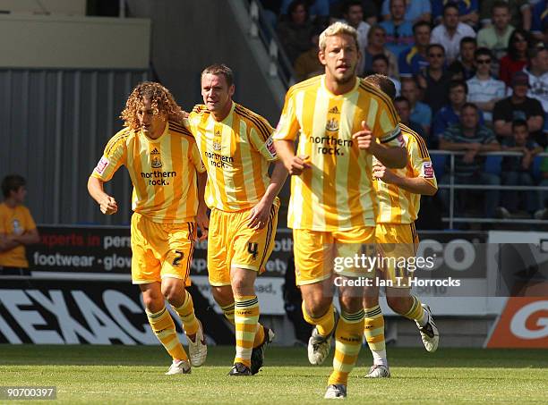 Fabricio Coloccini celebrates with Kevin Nolan after the first goal during the Coca-Cola League Championship match between Cardiff City and Newcastle...