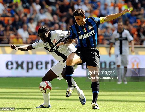 McDonald Mariga of Parma FC and Javier Zanetti of Inter FC during the Serie A match between Inter FC and Parma FC at Stadio Giuseppe Meazza on...