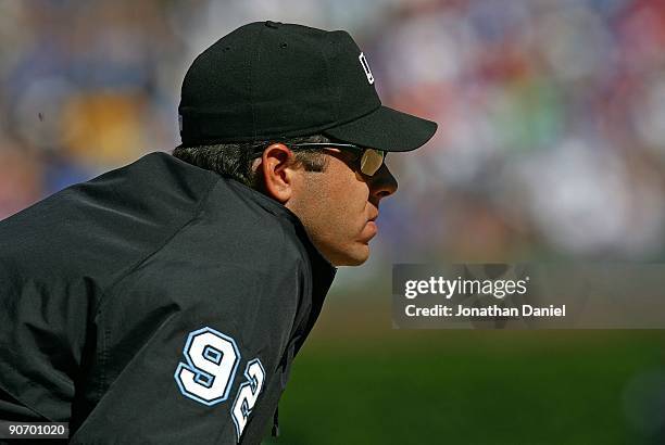 Third base umpire James Hoye watches the action during a game between the Chicago Cubs and the New York Mets on August 30, 2009 at Wrigley Field in...