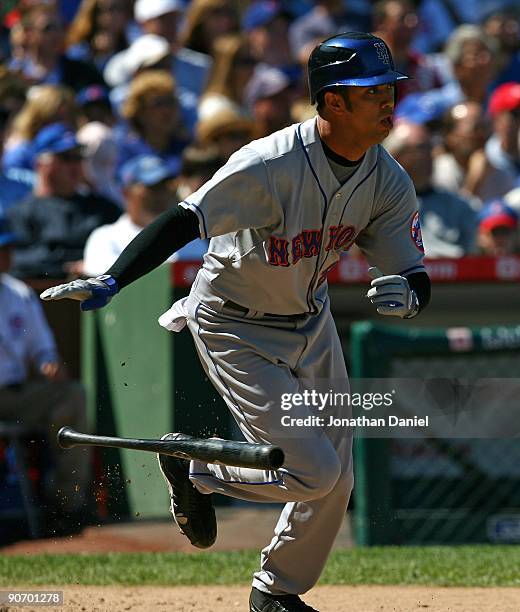 Nelson Figueroa of the New York Mets runs to first base after hitting against the Chicago Cubs on August 30, 2009 at Wrigley Field in Chicago,...