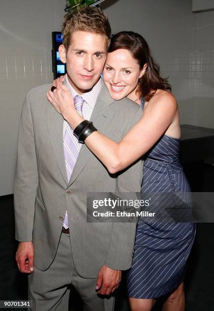 Actor Eric Szmanda and actress Jorja Fox appear at an exhibit during the grand opening of the CSI: The Experience attraction at MGM Grand...