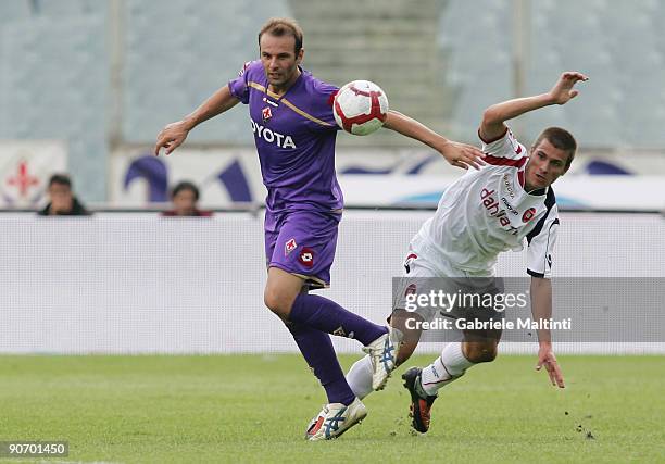 Cristiano Zanetti of Fiorentina in action against Michele Canini of Cagliari during the Serie A Tim match between Fiorentina and Cagliari at Stadio...