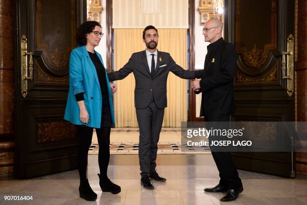 Newly elected Catalan parliament speaker Roger Torrent bids farewell to Republican Left of Catalonia secretary general Marta Rovira and Together for...