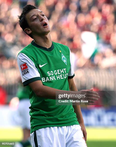 Mesut Oezil of Bremen reacts during the Bundesliga match between Werder Bremen and Hannover 96 at the Weser Stadium on September 13, 2009 in Bremen,...