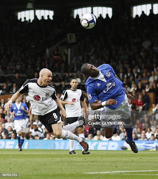 Fulham's English striker Andy Johnson vies with Everton's French defender Sylvain Distin during their Premier League football match against Everton...
