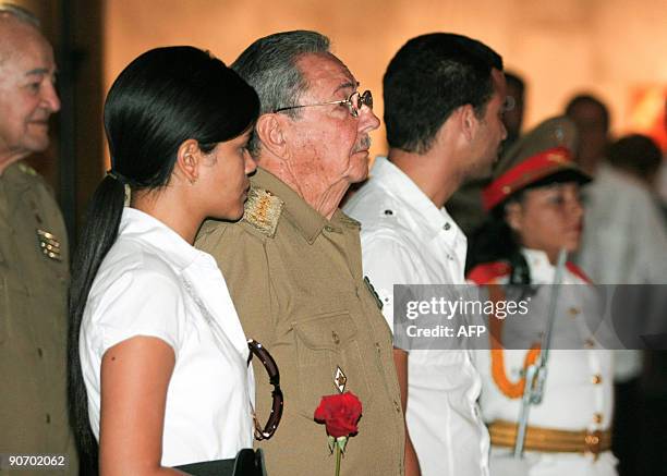 Cuba's President Raul Castro gestures near the daughter of late Cuban Vice-President Juan Almeida Bosque, Diana Almeida, during a homage ceremony in...