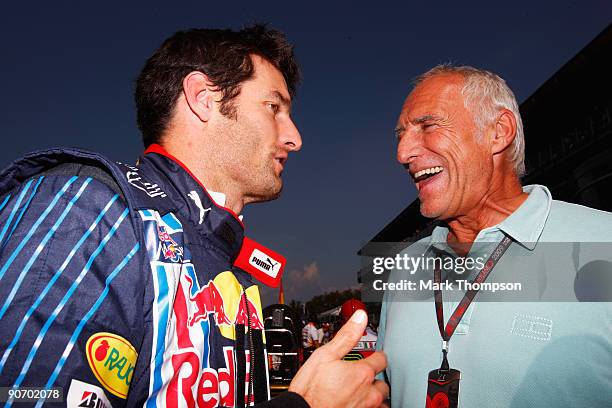 Mark Webber of Australia and Red Bull Racing talks with Red Bull Racing Chairman Dietrich Mateschitz on the grid before the Italian Formula One Grand...