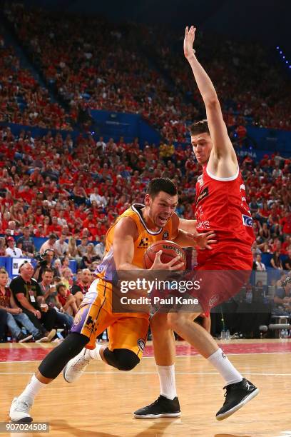 Jason Cadee of the Kings drives to the basket against Clint Steindl of the Wildcats during the round 15 NBL match between the Perth Wildcats and the...