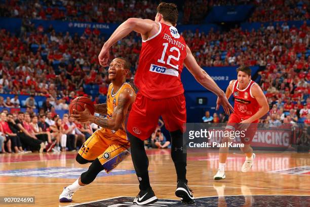 Jerome Randle of the Kings srives to the basket against Angus Brandt of the Wildcats during the round 15 NBL match between the Perth Wildcats and the...