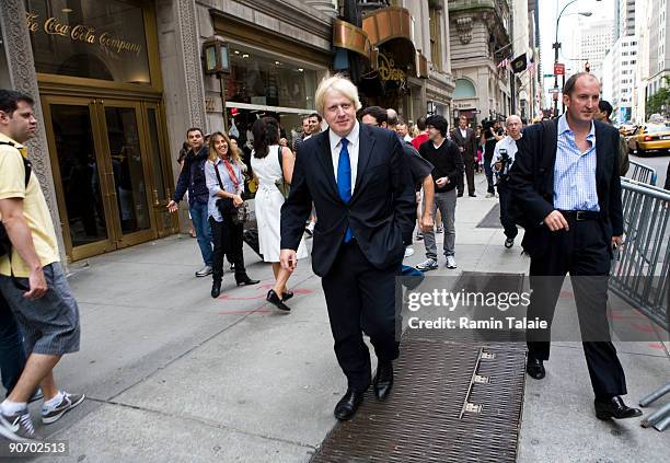 Mayor of London, Boris Johnson, leaves the Disney flagship store on Fifth Avenue after a news conference on September 13, 2009 in New York City....