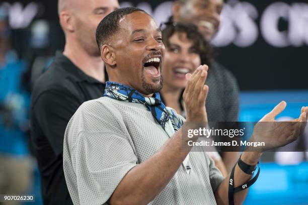 Hollywood actor Will Smith reacts to Australian tennis player Nick Kyrgios being interviewed on TV after his winning match against Jo Wilfred Tsonga...