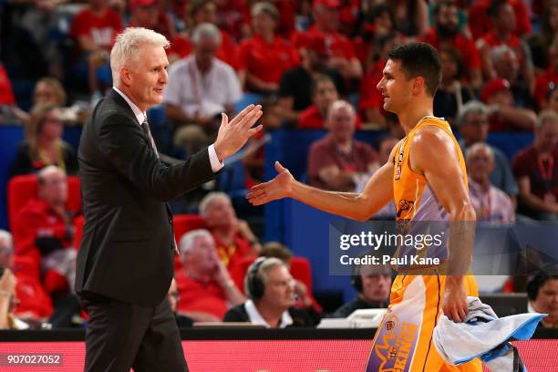 Andrew Gaze, coach of the Kings, acknowledges Kevin Lisch after checking out of thew game during the round 15 NBL match between the Perth Wildcats...