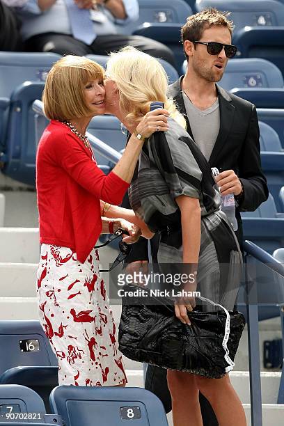 Editor-in-Chief of Vogue Anna Wintour greets actress Charlize Theron and actor Stuart Townsend at the match between Rafael Nadal of Spain and Juan...