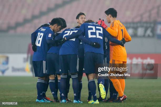 Players of Japan encourage each other during AFC U23 Championship Quarter-final between Japan and Uzbekistan at Jiangyin Sports Center on January 19,...